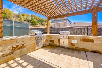 Outdoor kitchen with grilling station